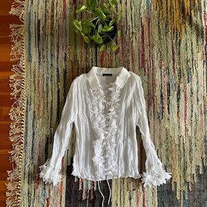 White blouse with feather design
